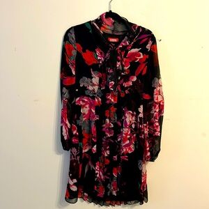 Red and black Long Sleeve dress with attached tie in the front.